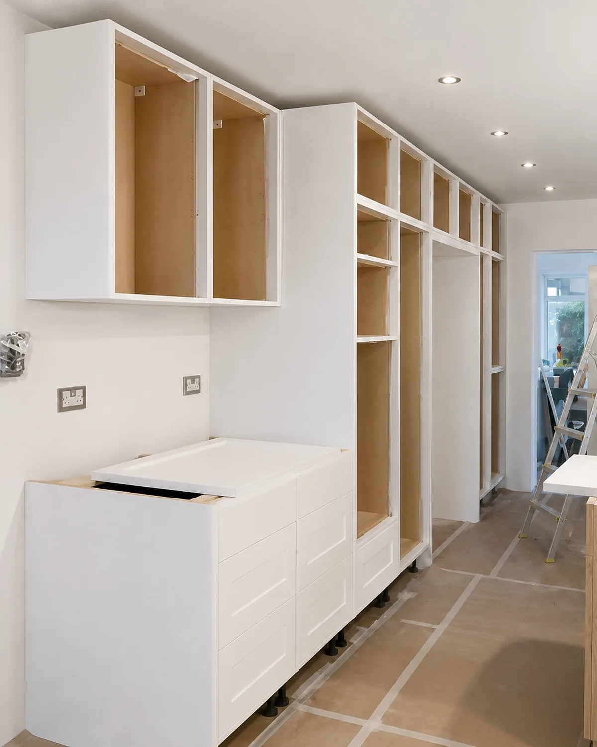 Tall cabinetry going in — bespoke kitchen by Ollie's Handmade Kitchens